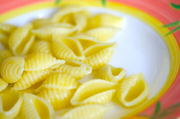 A plate of boiled pasta close-up. Children menu, lunch