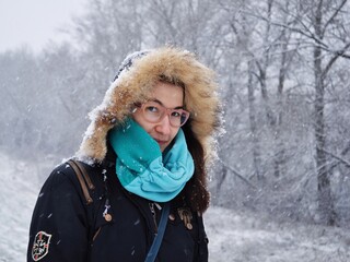 Young woman in warm clothing in wintertime