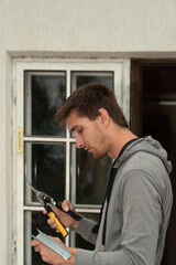 Repairman cutting metal.