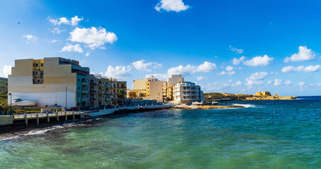 Fototapeta premium Qbajjar Bay in Gozo with Qolla l-Bajda Battery in the background.