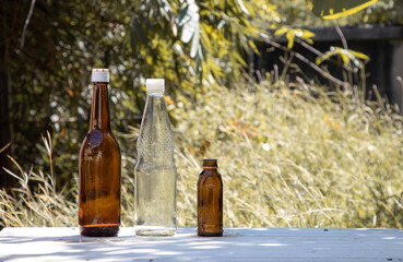 Glass bottle with natural background