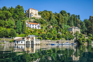 Fototapeta na wymiar The old town of Orta San Giulio is located on the coast of Lake Lago d, Orta opposite the island of San Giulio. The medieval monastery on the island is the main Shrine and attraction of the town. 