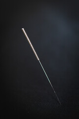 Close up of an acupuncture needle - obrazy, fototapety, plakaty