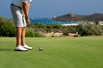 Obraz premium golf player in Villasimius field