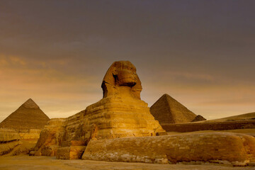 A sunset view of the Sphinx and Pyramids, Giza, Egypt