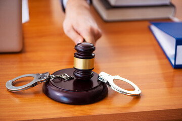 Young male lawyer sitting in the office