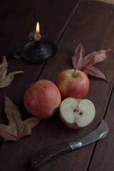 
Ripe red apples with bible or book Autumn background of leaves, fruits and vegetables. Fall season, eco food and harvest concept.

Red Braeburn apples on rustic wooden surface.