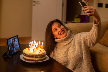 Woman celebrating her birthday remotely with her family.