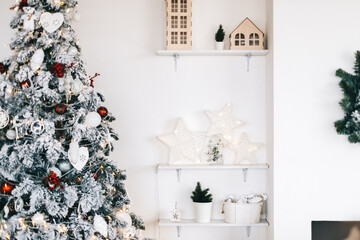 Beautiful Christmas tree in bright white living room.