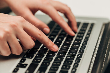 Close-Up Shot of Human Hands Placed Over Laptop