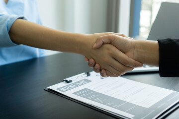 The idea of ​​interviewing managers and employees with a handshake after discussing the signing of a contract. And got into a company employee