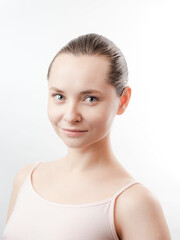 Beautiful Young Woman with Clean Fresh Skin look away .Girl beauty face care. Facial treatment . Cosmetology