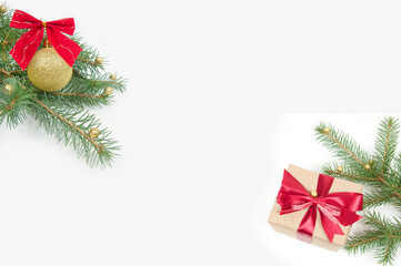 Christmas decoration, big gift box with red bow, yellow shiny ball, Christmas tree branch and big Christmas cone isolated on white background