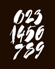 set of calligraphic acrylic or ink numbers. ABC for your design, brush lettering on a black background