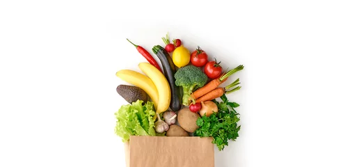 Zelfklevend Fotobehang Paper grocery bag full of healthy fruits and vegetables top view isolated on white background © Karlis