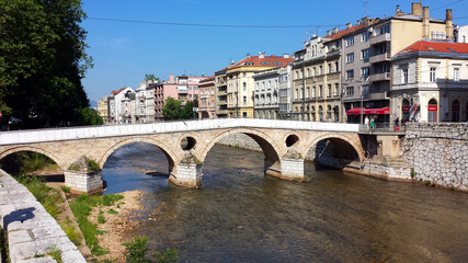 Obraz premium Sarajevo, Bosnia and Herzegovina - June 25, 2017: Latin Bridge and the houses on the river in Sarajevo.