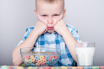 Portrait of a child refusing to eat breakfast. light breakfast concept
