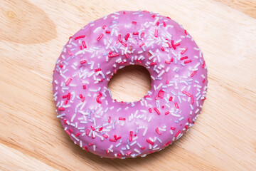 donut on a wooden background close-up. the view from the top