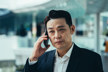 Close up photo of business man talking on mobile phone