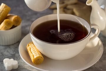 milk, milkman, tea, coffee, waffles, sweet, tea steam, pours, drops, splashes, cup, drink, breakfast, food, hot, white, beverage, cafe, spoon, brown, espresso, morning, table, caffeine, cream, bowl, s