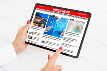 Sample news website shown on tablet computer