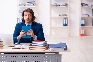 Young businessman student studying at workplace