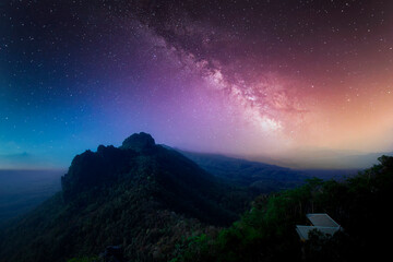 Fototapeta na wymiar Beautiful panoramic view universe space of colorful milky way galaxy with mountain, Space background with stars on a night sky, Long exposure photograph with grain or noise.
