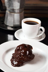 Choux with chocolate ganache and coffee cup