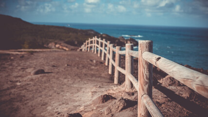 Wooden fence on Caribbean cliff