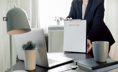 laptop resume hand woman workplace blank cv sheet application