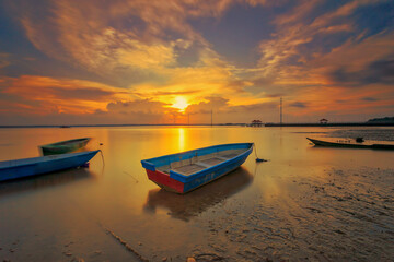 A scenic beauty of traditional fishing boat with sunset at Teluk Sengat,Johore, Malaysia with Soft focus due to long exposure