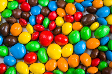 Fototapeta na wymiar M&M's candy on the white background, colorful candy, multicolored gradient