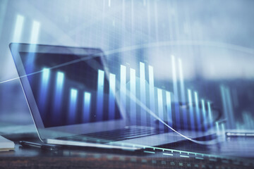 Forex Chart hologram on table with computer background. Multi exposure. Concept of financial markets.