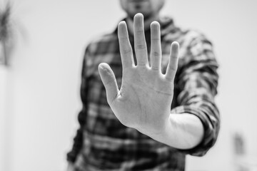 Defense or stop gesture: Male hand with stop gesture