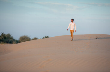 a man in a desert at surise