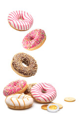 Delicious donuts and chocolate coins on a white background