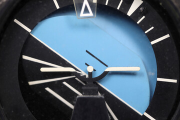 analogue attitude indicator showing climbing right bank