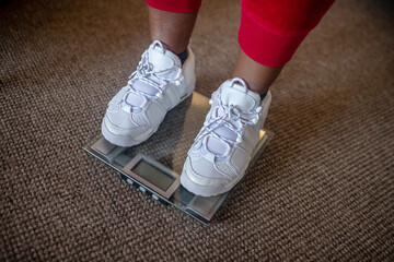 Close up picture of human feet on weighing machine - Powered by Adobe