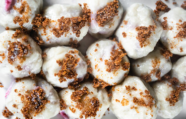 Top view image of polish meal plum dumplings.