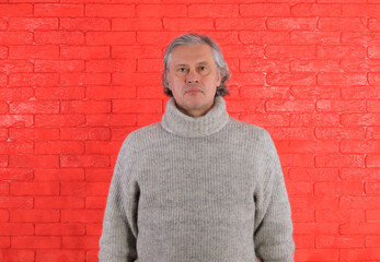 Obraz premium 50 year old man in gray sweater