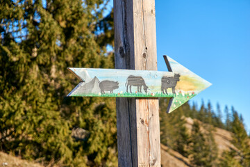 Alpine sign with animals on it