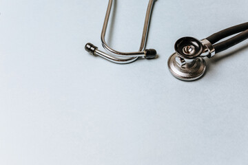 Medical concept flat lay with stethoscope on a blue background