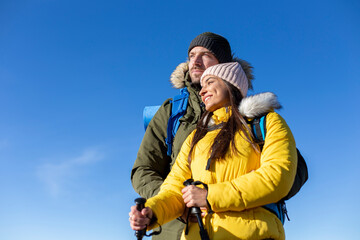 Portrait of the happy couple enjoying the beautiful view in the mountain. 