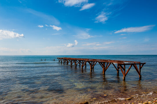 Old pier in the sea