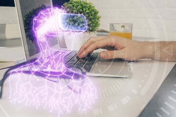 AR hologram with man working on computer on background. Augmented reality concept. Double exposure.