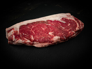 Raw ribeye beef steak. Texture of marble meat. Top view. 