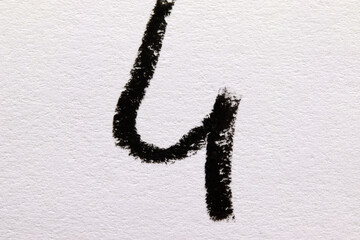 number four made of black and white crayon
