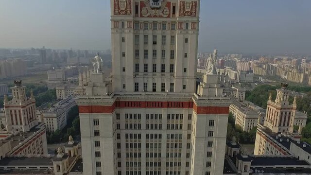 the statues are on the facade of the main building of Moscow State University