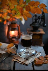 Fototapeta na wymiar Autumn leaves, Coffee Grinder and cup of black coffee. Background for website, bloggers, social media. 