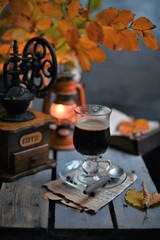 Autumn leaves, Coffee Grinder and cup of black coffee. Background for website, bloggers, social media. 